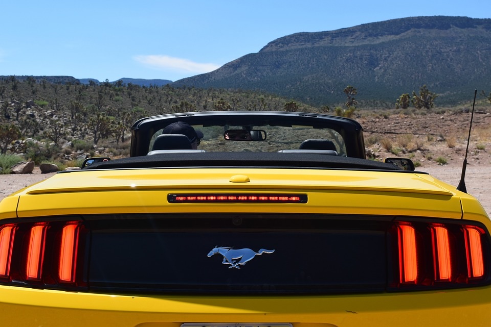 yellow convertible mustang